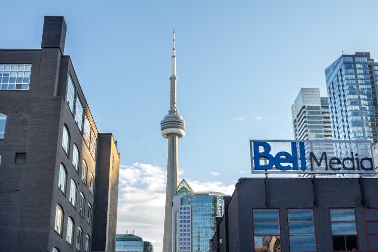 Bell Media main office for Toronto and its logo with the Canadian National Tower (CN Tower) in the background. Bell Media is one of the biggest mass media and television broadcasting company in North America