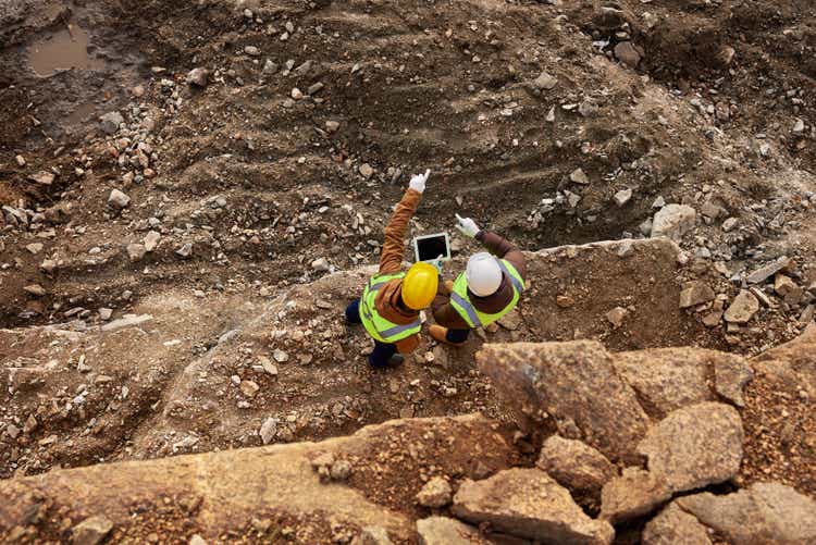 Construction Workers Inspecting Site