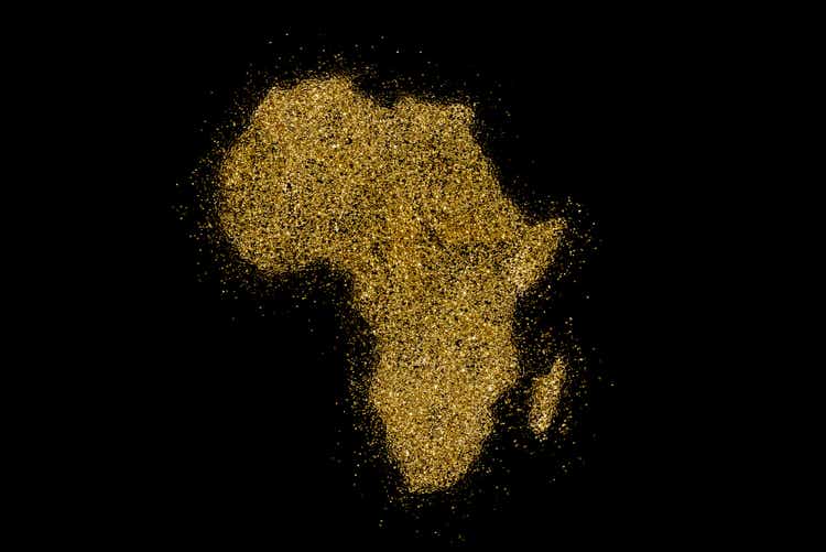 Africa shaped from golden glitter on black (series)