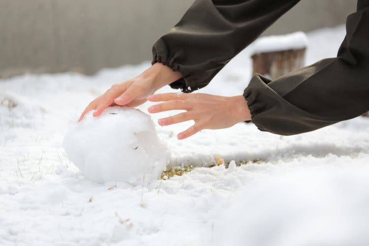 Man playing with snow