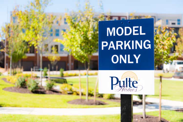 Pulte Model Home Parking street sign with background of townhouses at mount vineyard in downtown city in Virginia