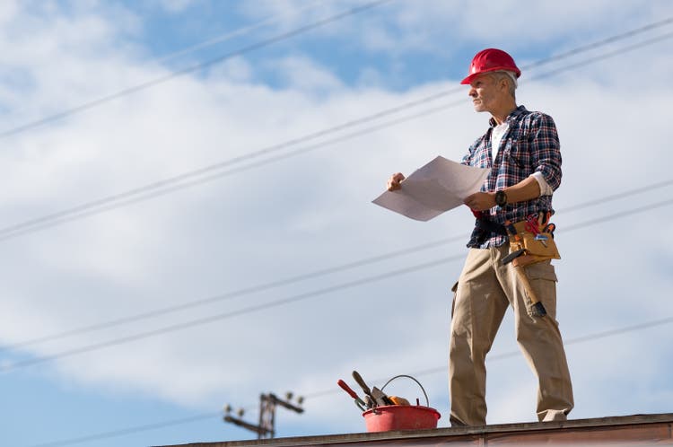 Construction worker on rooftop