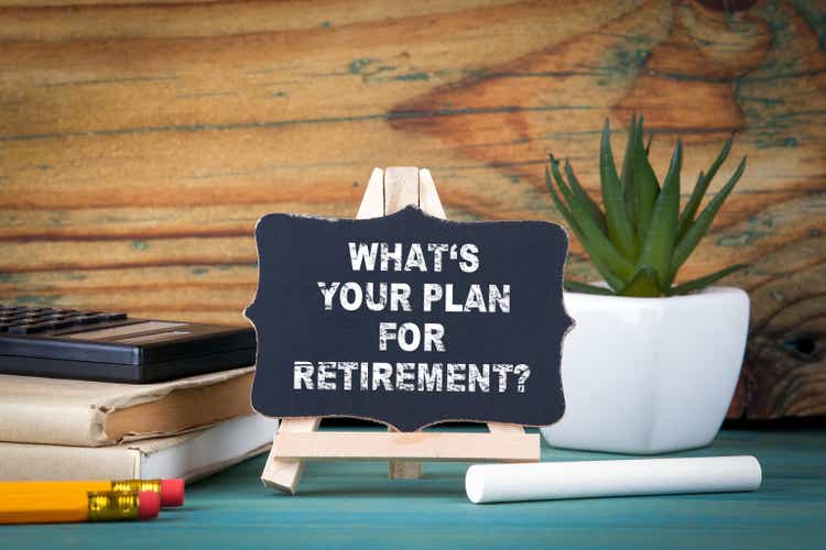 What"s Your Plan for Retirement. small wooden board with chalk on the table