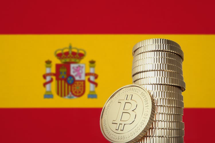Bitcoin stack with Spain flag in the background