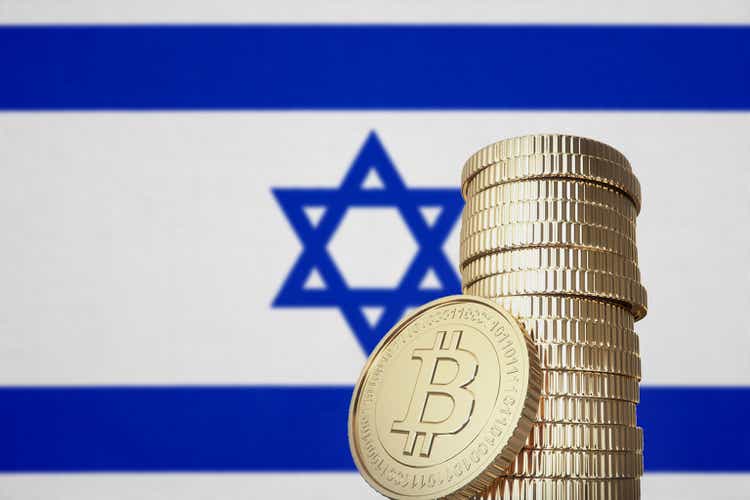 Bitcoin stack with Israel flag in the background