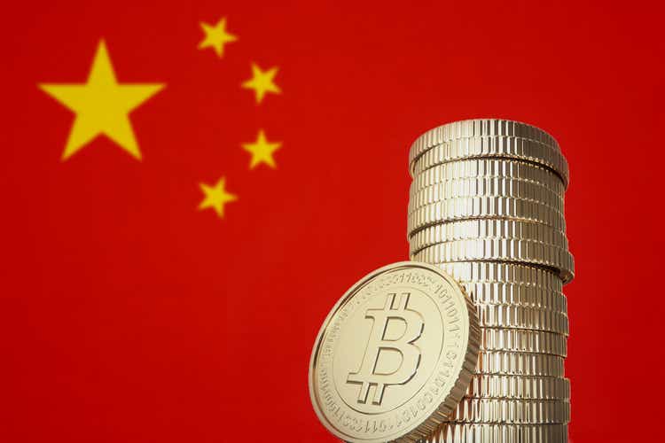 Bitcoin stack with China flag in the background