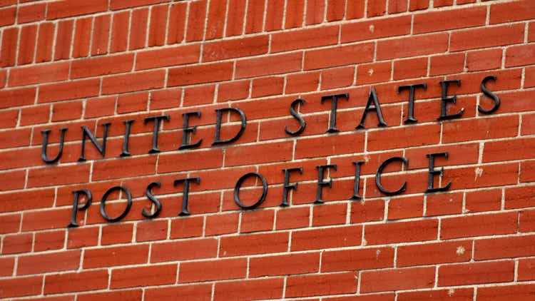 US Post Office Sign on Brick Building