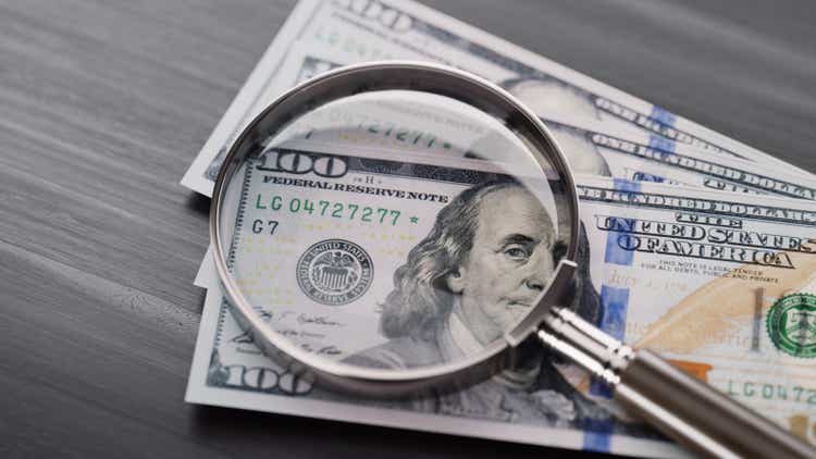 Closeup Of Fifty Dollar Bills On Wooden Table. Fifty Dollar Stock