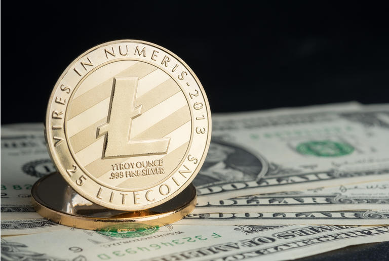 crypto currency gold litecoin on dollar banknote on black table,Virtual digital money concept.financial business.