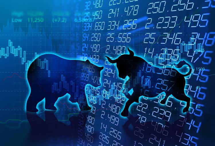 silhouette form of bull and bear on technical financial graph