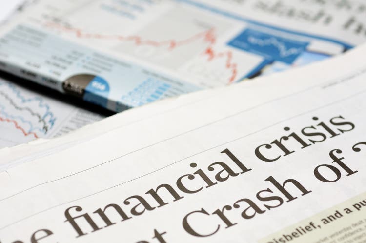 Close up of newspaper headline for financial crisis news