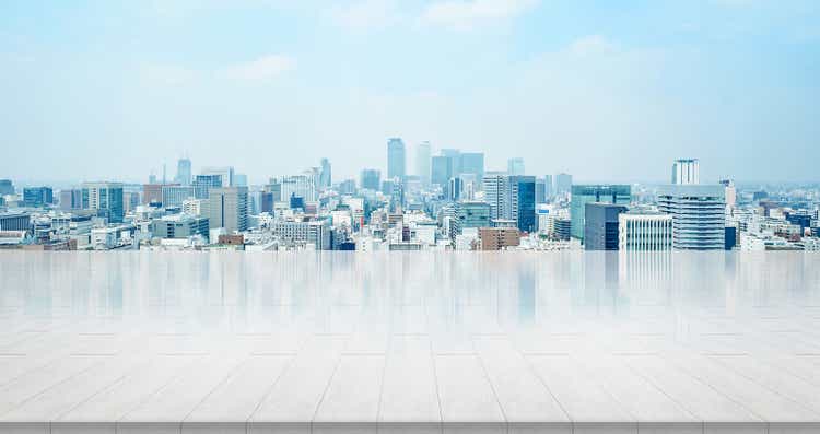 empty stone panel ground with panoramic city skyline aerial view under bright sun and blue sky of nagoya, Japan
