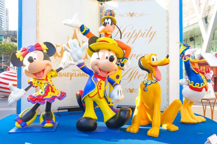 Mickey Mouse and Disney friends fiber glass mascots for display during Christmas. Their outfit is fancy parade costume.