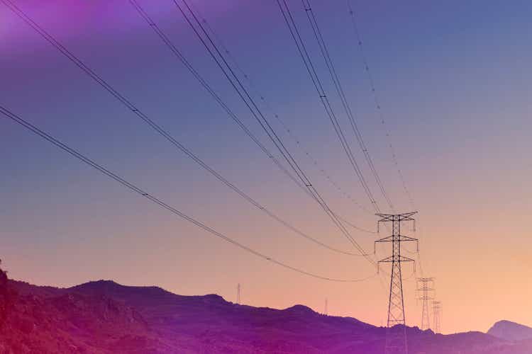 Electricity pylons at sunset