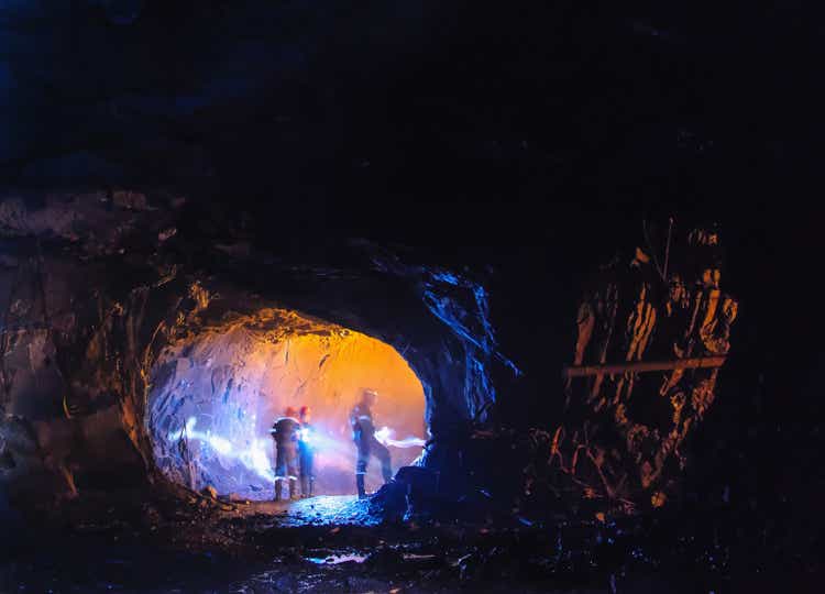 Diggers in a big cave