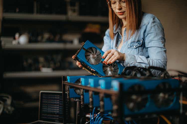 Young redhead building a miner