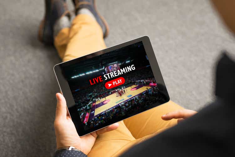 Man watching sport on live streaming online service