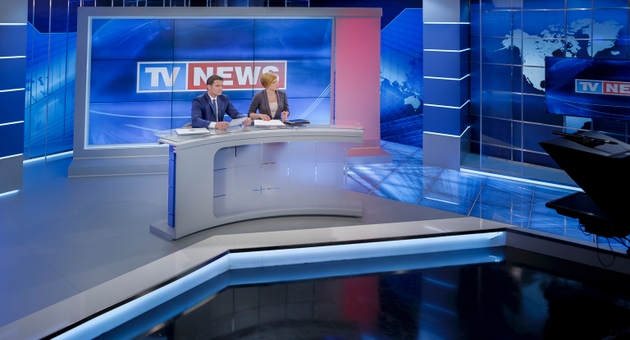 Newsreaders in television studio