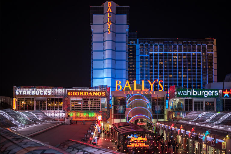 Bally"s Hotel and Casino lit up at night in Las Vegas