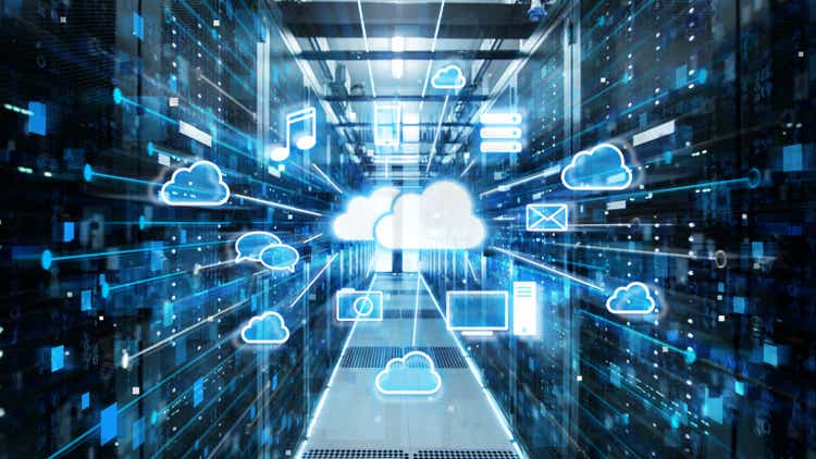 Shot of corridor in a working data center filled with server racks and supercomputers with icons displaying the benefits of cloud storage.