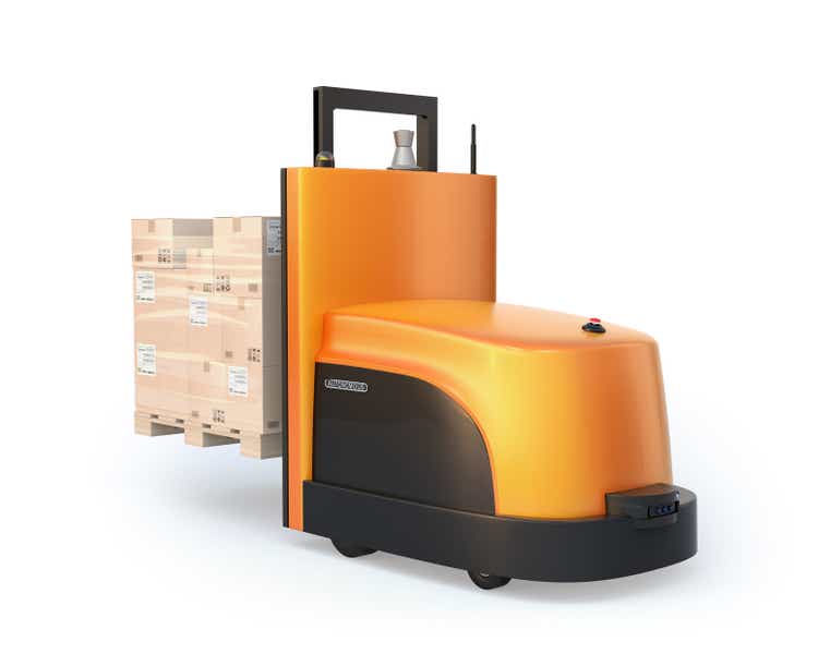 Rear view of autonomous forklift carrying pallet of goods isolated on white background