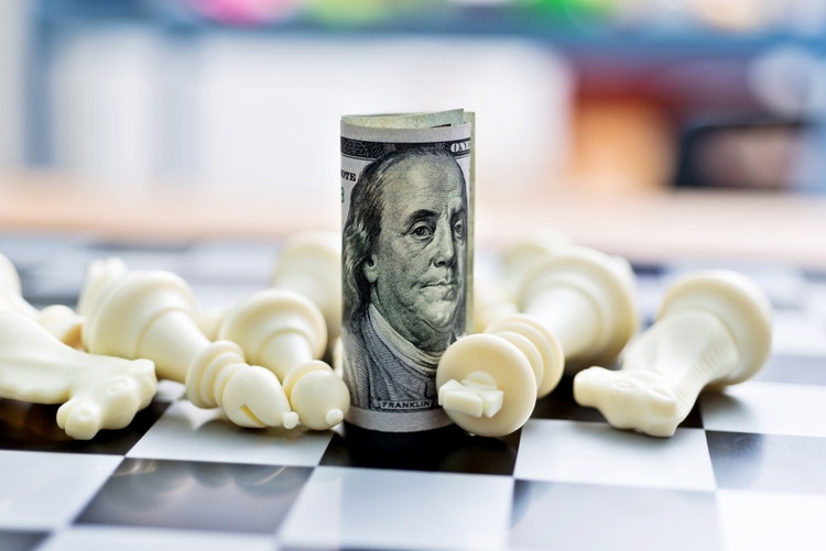 US dollar and chess pieces