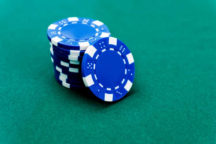 A stack of blue poker chips on the table