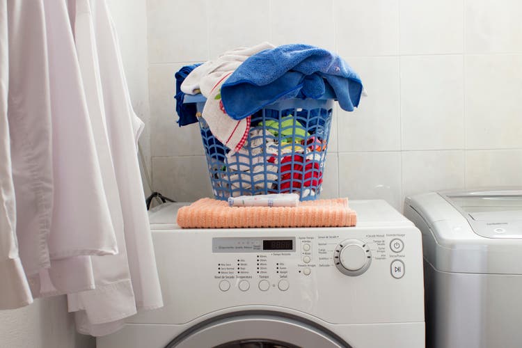 Clean laundry basket over the washing machine.