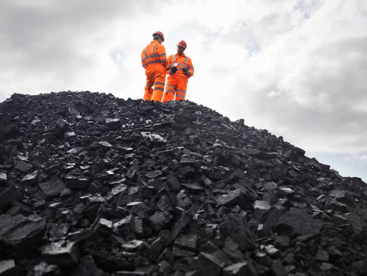 Coal miners on the coal pile