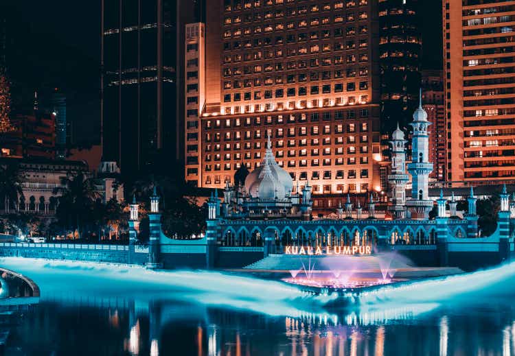 Jamek mosque in the heart of Kuala Lumpur in Malaysia at night in front of river of life