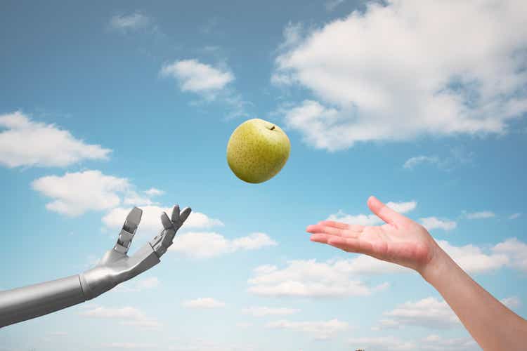 Artificial intelligence passes a green apple to a girl