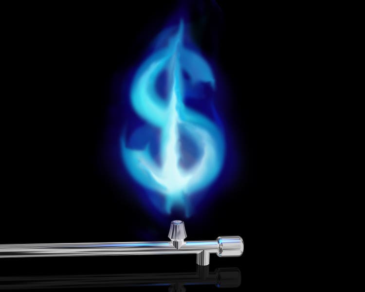 Blue gas flame from silver pipe in dollar sign shape