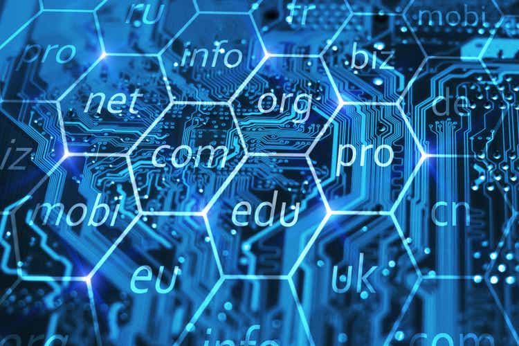 Internet domain name registration.  Online URL address for a business.  Com, biz, info, edu and other domains in hexadecimal on integrated circuit.