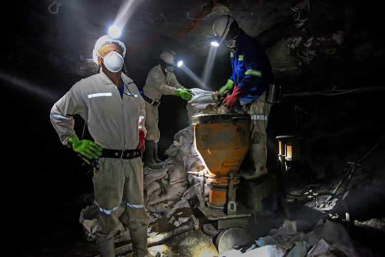 Underground Platinum Chrome miners mixing cement