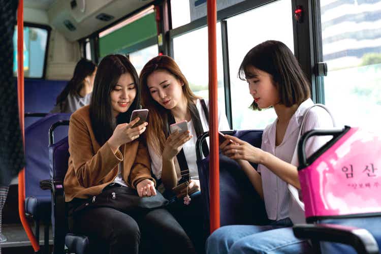 Korean women friends visiting Seoul by bus in their first holiday together