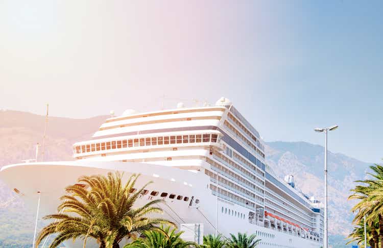 Cruise ship. Large luxury white cruise ship liner on sea water and cloudy sky background. Montenegro, Kotor