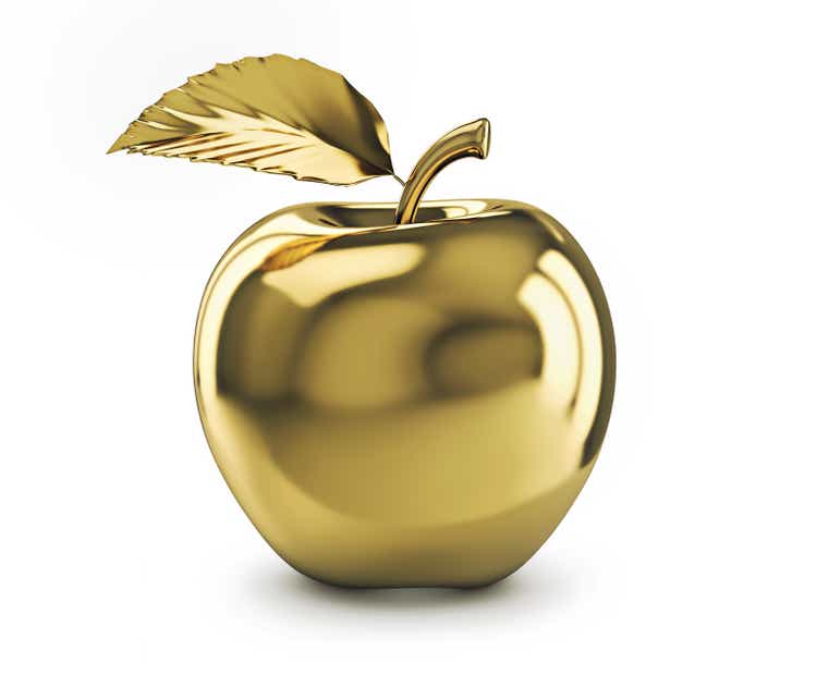 Golden apple isolated on white background