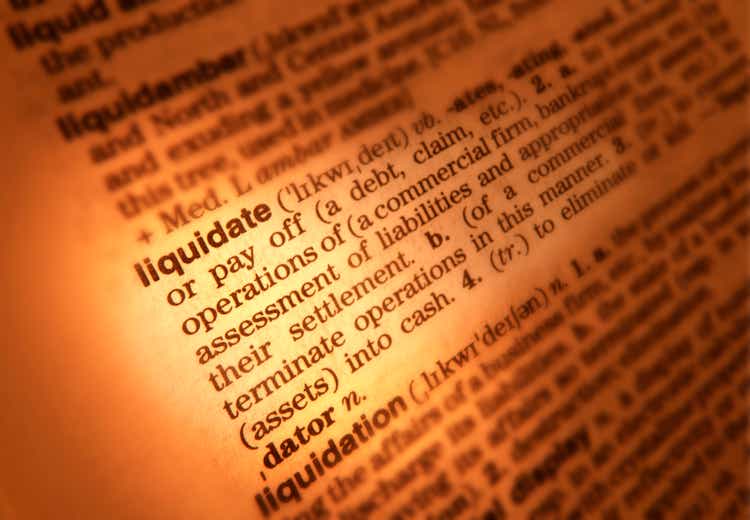 DICTIONARY PAGE SHOWING DEFINITION OF THE WORD LIQUIDATE