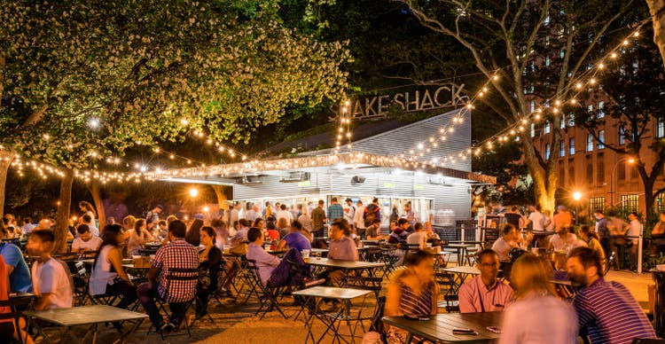 A summer evening at Shake Shack in Union Square Park. Midtown, Manhattan, New York City