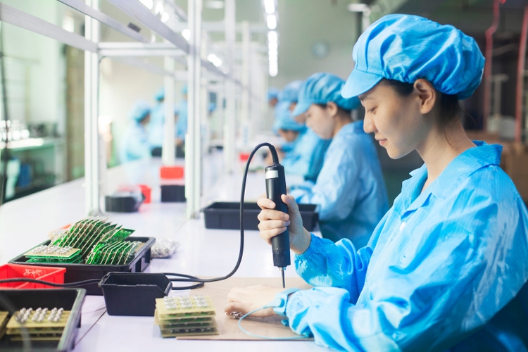 Workers in uniforms at a LED lighting factory in Dongguan, China