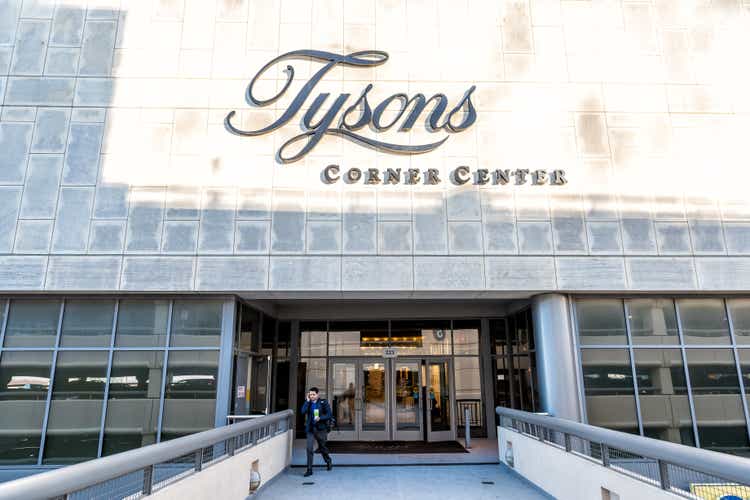 Sign, entrance doors on bridge to Tyson"s Corner Mall in Fairfax, Virginia by Mclean with people walking