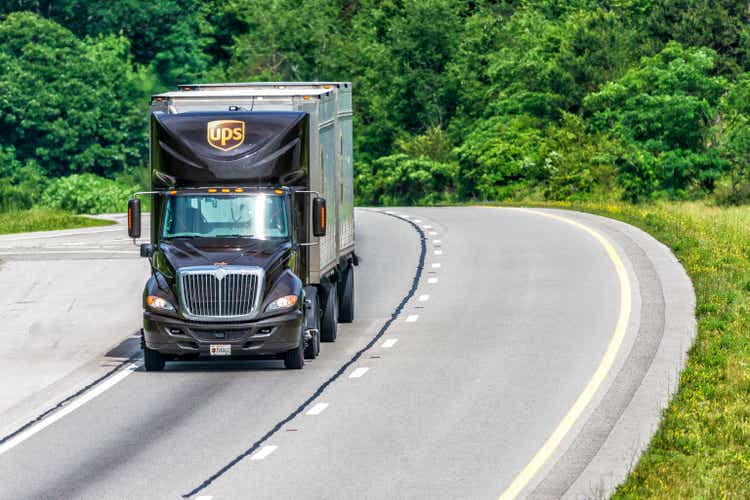 UPS Dual Trailer Rig Travels Interstate with Copy Space"n