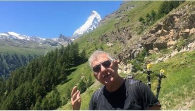 John on Steep Mountainside