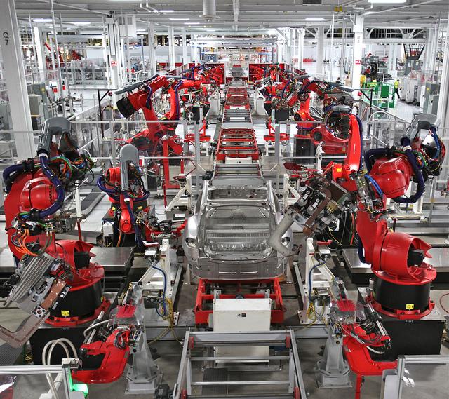 Robots assemble cars in Tesla