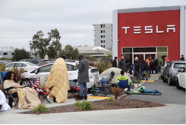 people wait outside to reserve Model 3