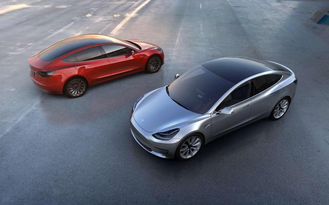 Two Tesla Model 3s side by side