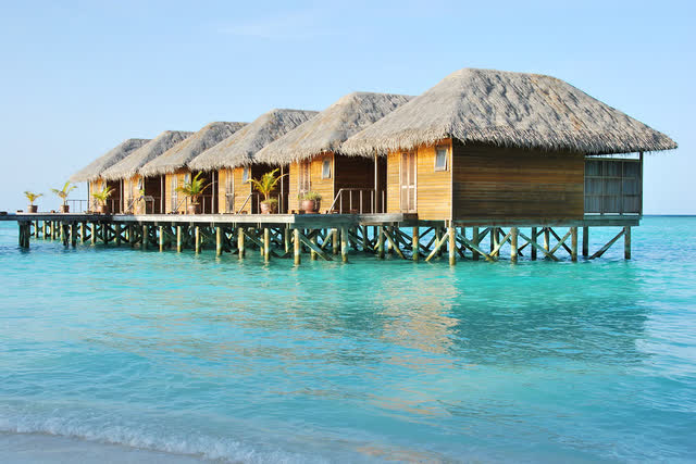 A picture containing outdoor, water, house, mountain Description automatically generated
