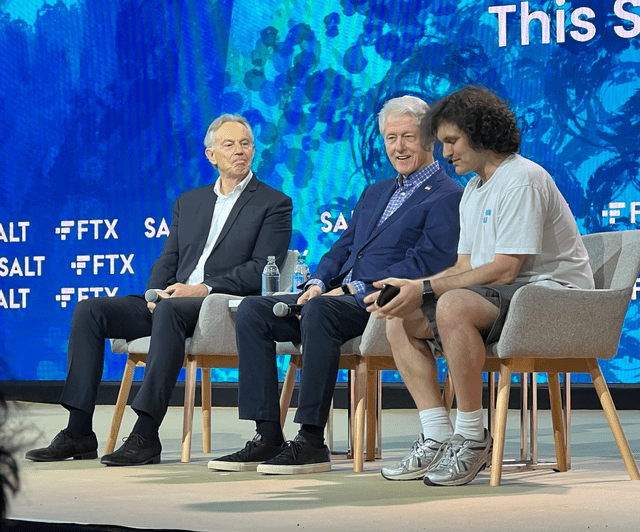FTX CEO Sam Bankmen-Fried sits on stage with Bill Clinton and Tony Blair