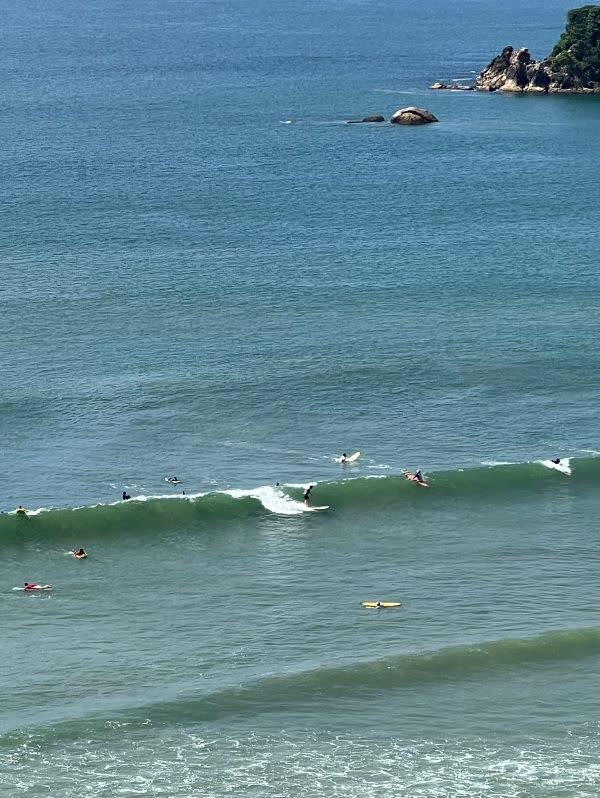 Surfers catching the waves at Weligama