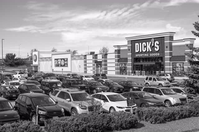 A black-and-white photo of a big-box retail center.